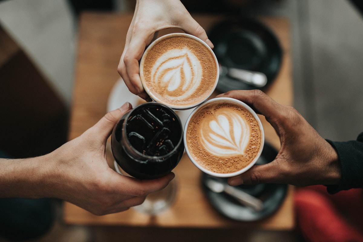 Friends sharing coffee and conversation at a local cafe