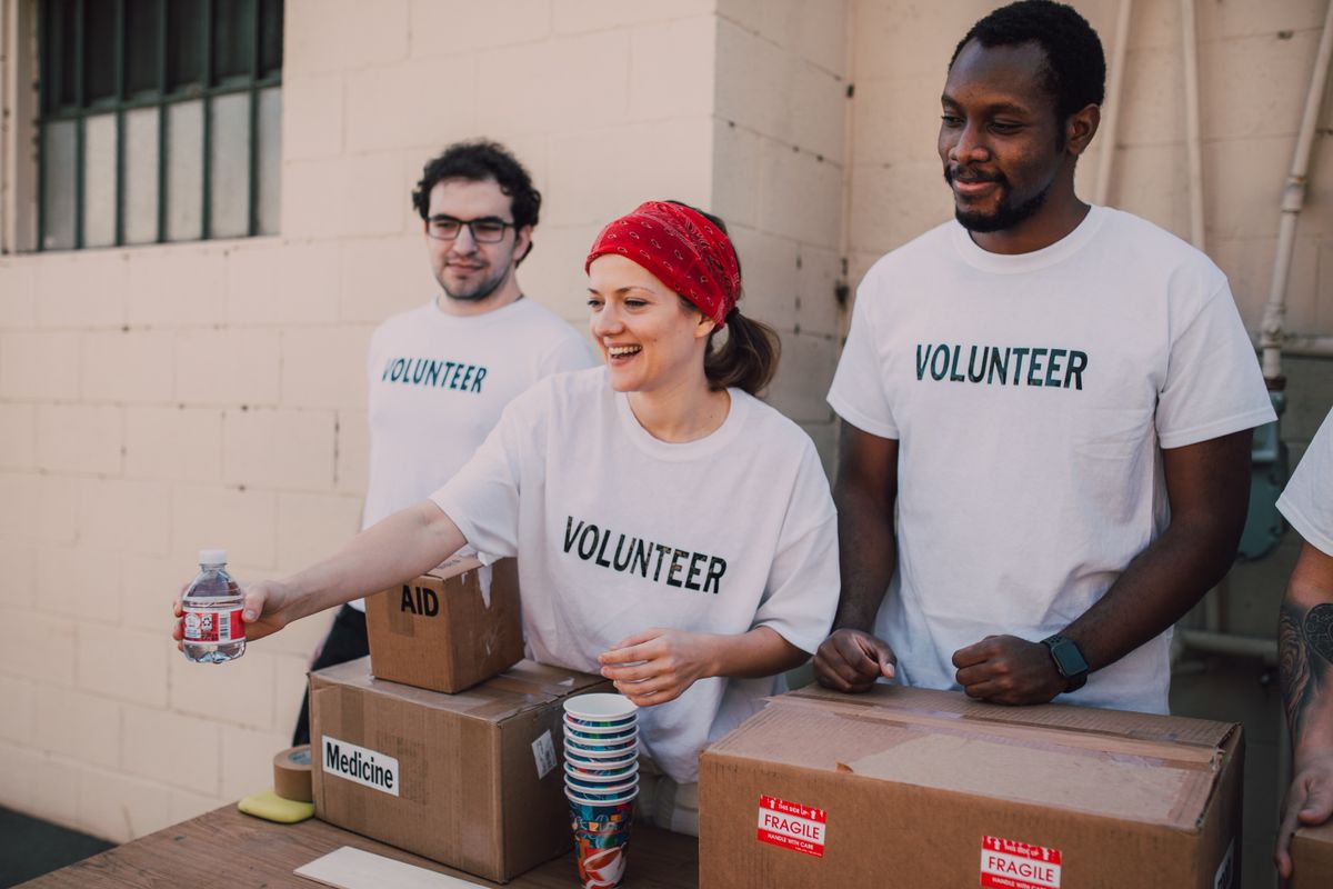 Volunteers organizing supplies for a charity event